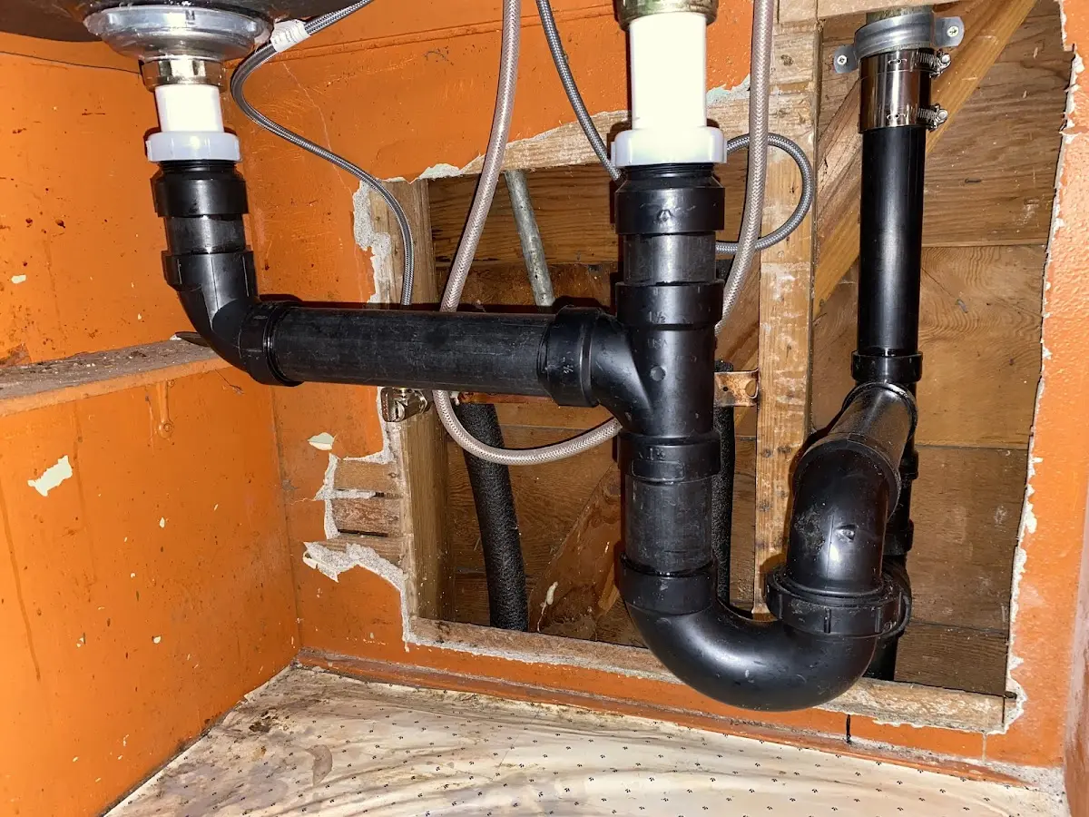 Professional Garbage Disposal Repair equipment and tools on the job in North Fayette